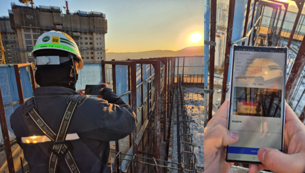 HDC현대산업개발 관계자가 ‘I-QMS(IPARK-Quality Management System)’을 활용해 현장 안전점검을 하고 있다. [사진=HDC현대산업개발]